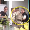 Šiptari snimili išlo na Tv: Vojnik KFOR-a kupuje srpsku zastavu od dečaka iz Leposavića