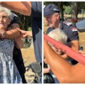 Policija uz osmeh vukla baku (80) tokom protesta građana na beogradskom Savskom keju (VIDEO)