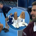 Novak pozvao lekara, pa legao na teren: Meč u Pekingu hitno prekinut zbog Đokovića