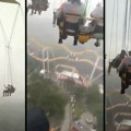 Luna park vožnja iz noćnih mora: Posetioci ostavljeni da vise 60 metara u vazduhu zbog pogoršanja vremena (video)