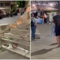 Sramotne scene u centru Beograda: Huligan u crnom šutirao cveće i sveće za ubijenu tiktokerku Nou, pa cepao LGBT zastavu…