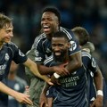 Vinisijus utišao etihad u nadoknadi: Real, Arsenal i PSŽ u četvrtfinalu Lige šampiona