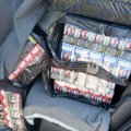 (Foto) Zaplenjeno skoro 800 bokseva cigareta, oko 50 kilograma rezanog duvana i novac: Uhapšena žena (49) u Beogradu