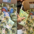 "Jadna: Beba..." Hit snimak na TikToku: Novorođenče zatrpali novčanicama od 100€, jedva se nazire iz kreveca (video)