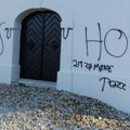 Ustaški grafiti i hrvatski barjak na parohijskom domu