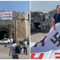 Aktivisti skinuli sramni transparent “Bolje ćaci nego naci” sa kukastim krstom sa niške Tvrđave (VIDEO)