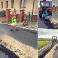 Marko, ti li si? Radnici postavili asfalt, on izorao put Kaže da je njegov, terao bi traktorom i dalje od 200 metara da ga…