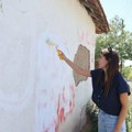 KoSSev: Aktivisti YIHR na kući na Kosovu prefarbali grafite 'UČK' 'Faton Hajrizi'