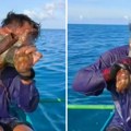 Улов из ноћне море! Хоботница се залепила за лице рибара и не пушта: Погледајте како се спасао