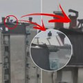 Jeziv snimak iz Kragujevca! Muškarac se popeo na sims zgrade dok nevreme razara sve oko njega