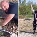 "Amazon iz Merošine, sila": Vladica izvukao zmiju dugu skoro dva metra iz betona u Merošini (video)