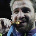 Zašto olimpijci grizu svoje medalje?